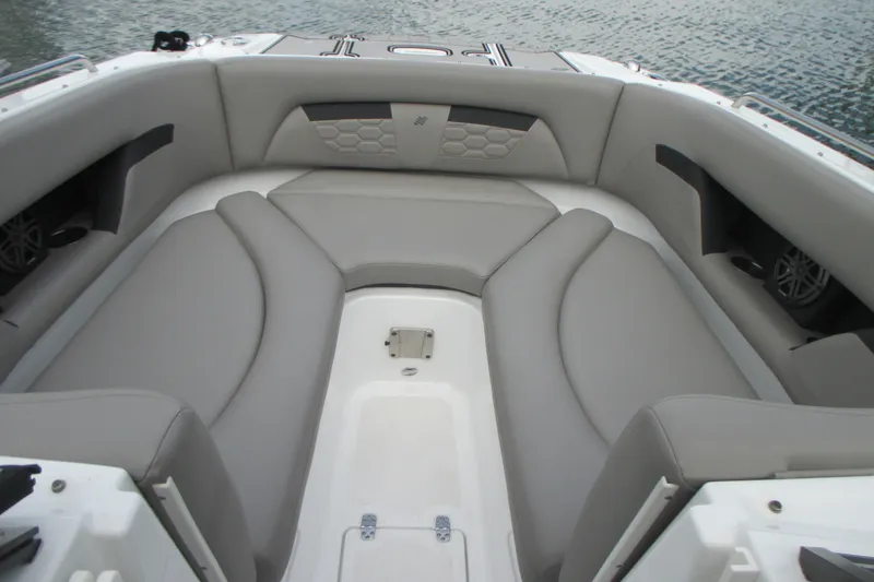 Slide: The Image of 2022 Four Winns HD8 OB boat interior with gray seating and water view. - 18