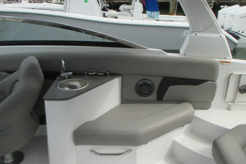 Slide: The Image of Interior of 2022 Four Winns HD8 OB boat with seating and sink area. - 10