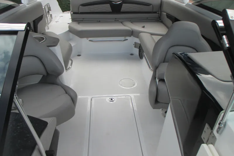 Slide: The Image of 2022 Four Winns HD8 OB boat interior with gray seating and sleek design. - 8