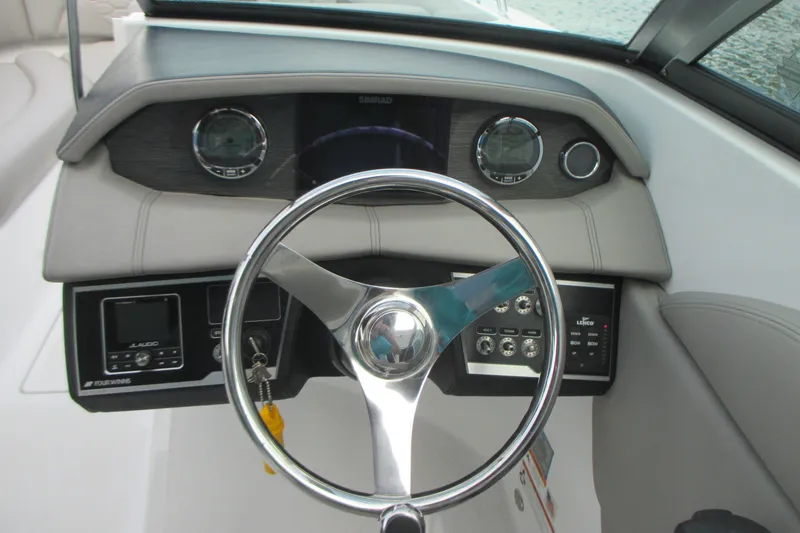 Slide: The Image of Steering wheel and dashboard of 2022 Four Winns HD8 OB boat. - 14