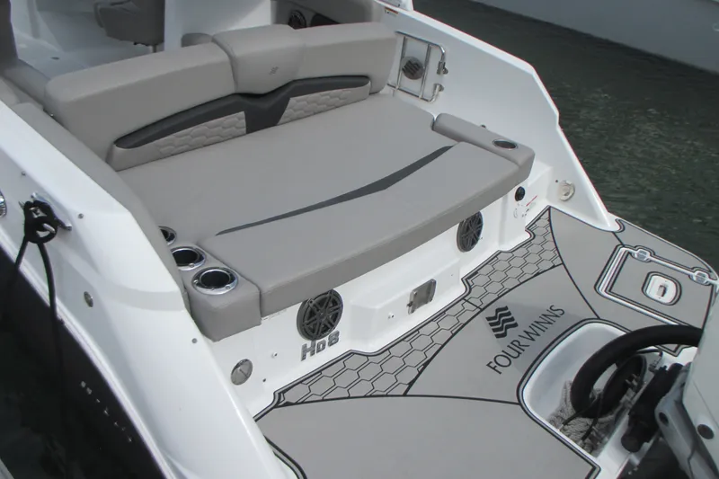Slide: The Image of 2022 Four Winns HD8 OB boat with sleek seating and modern design. - 5