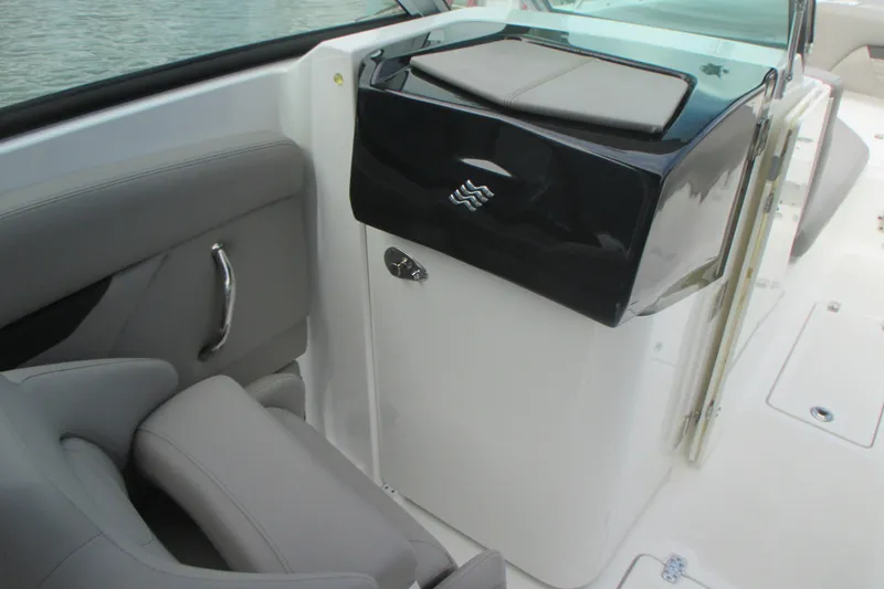 Slide: The Image of 2022 Four Winns HD8 OB boat interior with sleek seating and modern console design. - 16
