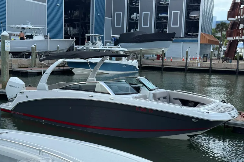 The Image of 2022 Four Winns HD8 OB boat docked at marina, featuring sleek design and Mercury outboard engine. - 0
