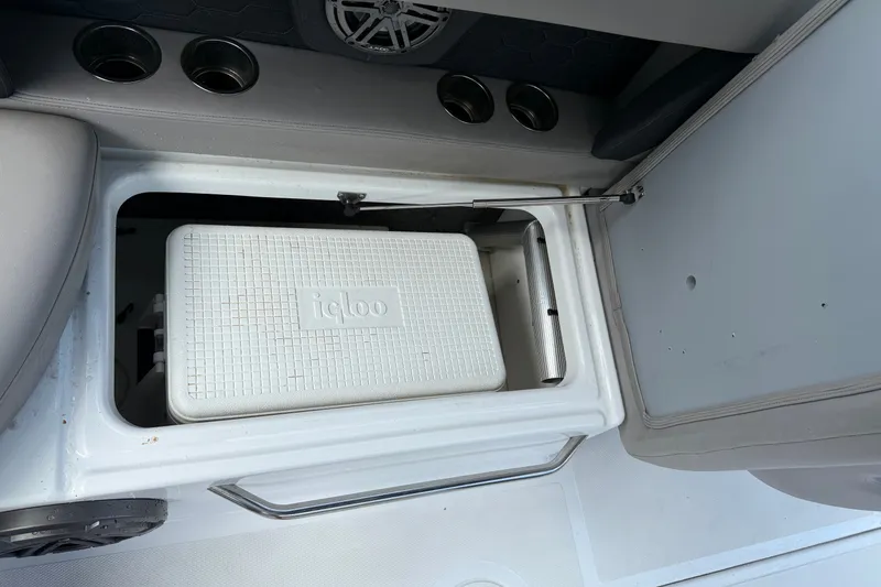 Slide: The Image of Storage compartment with Igloo cooler on 2022 Four Winns HD8 OB boat. - 11