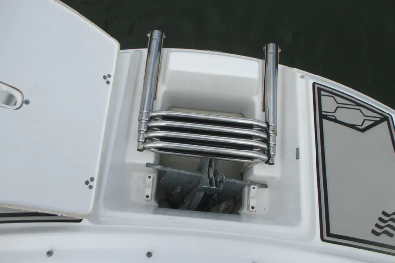 Slide: The Image of 2022 Four Winns HD8 OB boat ladder and anchor compartment detail. - 21