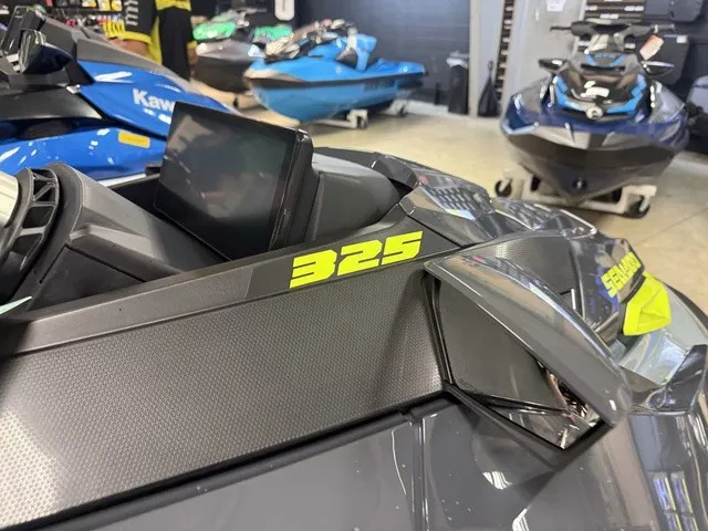 Slide: The Image of Close-up of a 2026 Sea-Doo RXT-X jet ski with the number 325. - 8