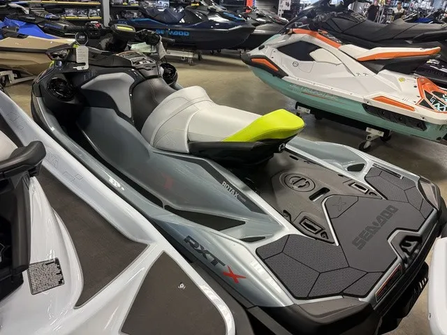 Slide: The Image of A gray 2026 Sea-Doo RXT-X jet ski with a sporty design and comfortable seating. - 5