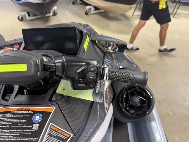 Slide: The Image of Close-up of a 2026 Sea-Doo RXT-X with detailed controls and grips. - 16