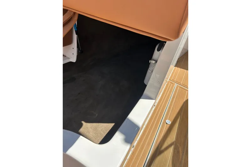 Slide: The Image of Interior view of a 2000 MasterCraft MariStar 210 VRS boat, featuring seating and flooring. - 22