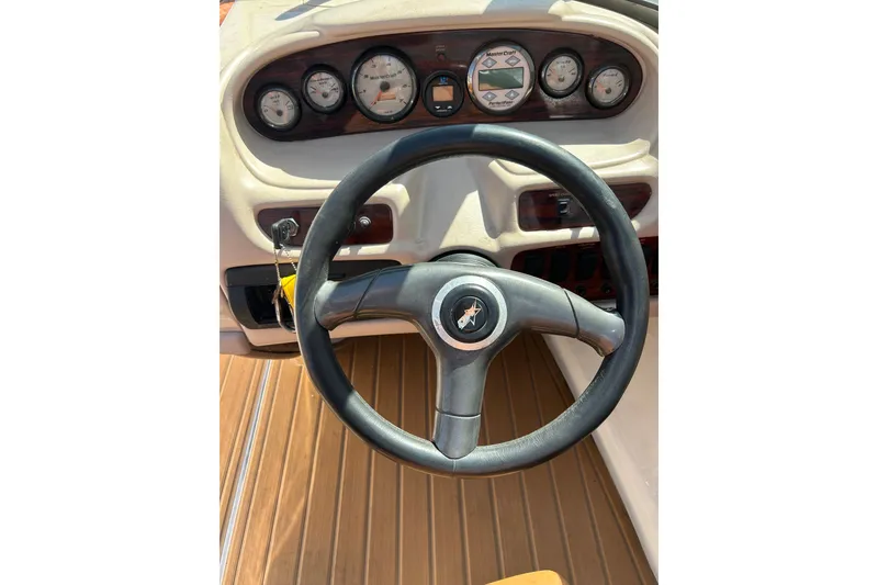 Slide: The Image of Steering wheel and dashboard of 2000 MasterCraft MariStar 210 VRS boat. - 13