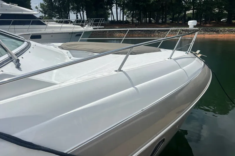 Slide: The Image of 2008 Cruisers Yachts 330 Express docked, showcasing sleek design and polished exterior. - 10
