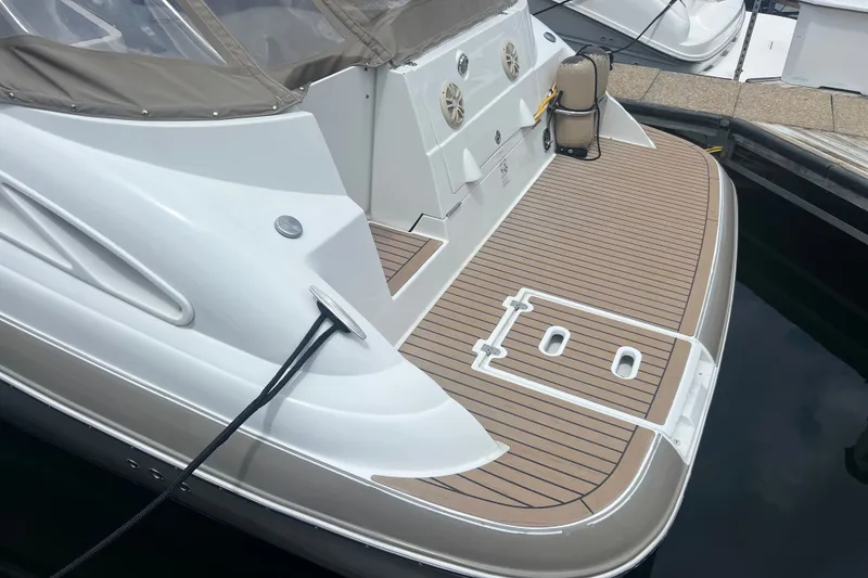 Slide: The Image of 2008 Cruisers Yachts 330 Express boat with teak swim platform at dock. - 13