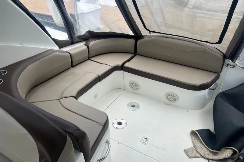 Slide: The Image of 2008 Cruisers Yachts 330 Express interior with beige and brown seating arrangement. - 17