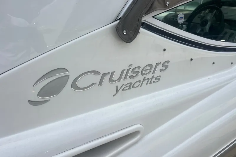 Slide: The Image of 2008 Cruisers Yachts 330 Express logo on white yacht exterior. - 16