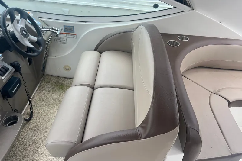 Slide: The Image of 2008 Cruisers Yachts 330 Express interior with steering wheel and seating area. - 20