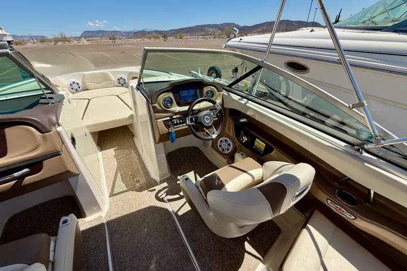 Slide: The Image of Interior of 2014 Chaparral 226 SSi boat with steering wheel and seating. - 29
