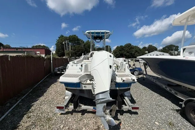 Slide: The Image of 2022 Finseeker 230 FS boat on trailer, parked outdoors under a clear sky. - 4