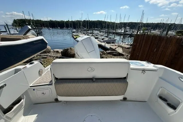 Slide: The Image of 2022 Finseeker 230 FS boat interior with marina view in the background. - 11