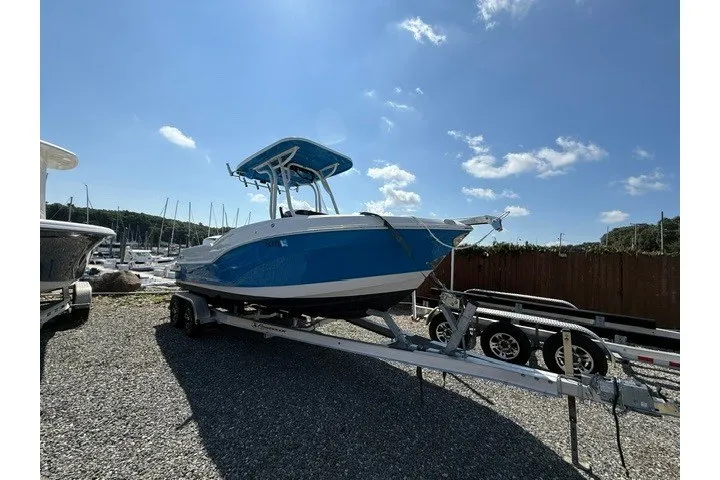 The Image of 2022 Finseeker 230 FS boat on trailer under clear blue sky. - 1