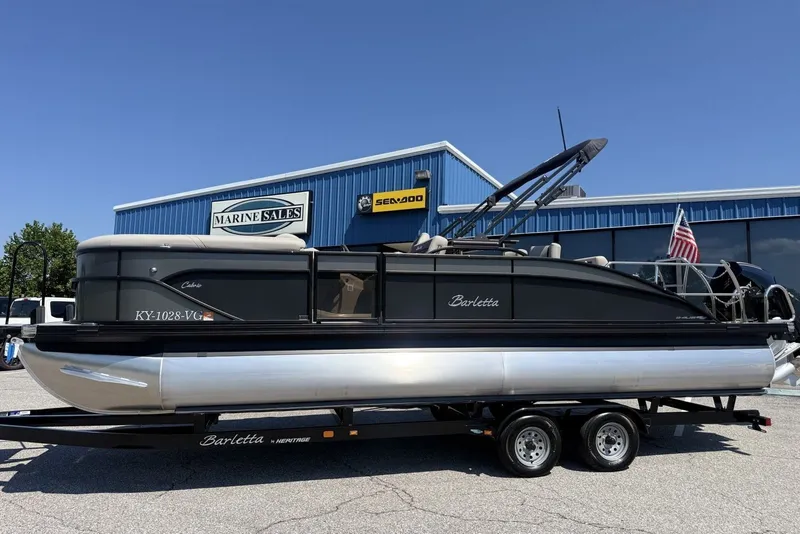 Slide: The Image of 2025 Barletta Cabrio 24UE pontoon boat on trailer at Marine Sales dealership. - 34