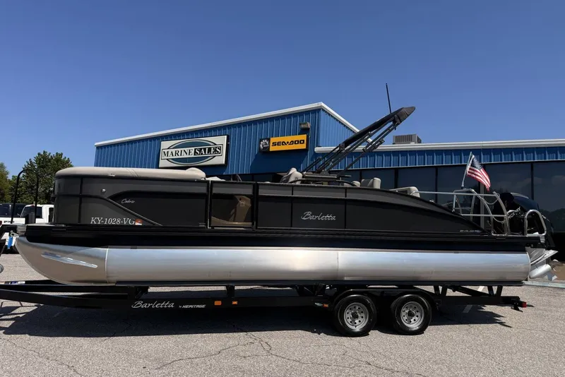 Slide: The Image of 2025 Barletta Cabrio 24UE pontoon boat on trailer at Marine Sales dealership. - 32