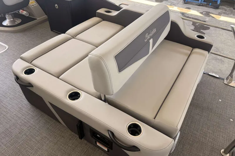 Slide: The Image of Luxurious seating on the 2025 Barletta Cabrio 24UE pontoon boat with integrated cup holders. - 20