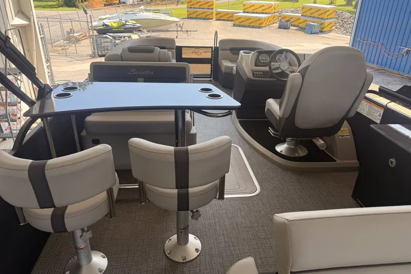 Slide: The Image of Interior of 2025 Barletta Cabrio 24UE pontoon boat with seating and helm. - 26