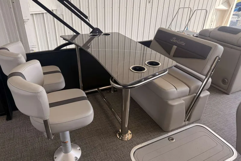 Slide: The Image of 2025 Barletta Cabrio 24UE interior with sleek seating and modern table design. - 18