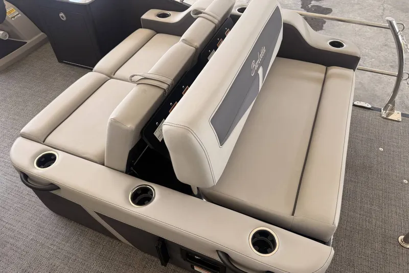 Slide: The Image of 2025 Barletta Cabrio 24UE boat seating with cup holders and sleek design. - 24