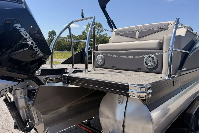 Slide: The Image of 2025 Barletta Cabrio 24UE pontoon boat with Mercury engine, rear view. - 31