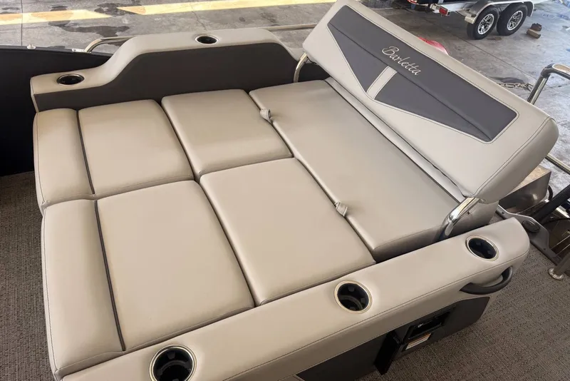 Slide: The Image of 2025 Barletta Cabrio 24UE boat seating with cup holders and elegant upholstery. - 21