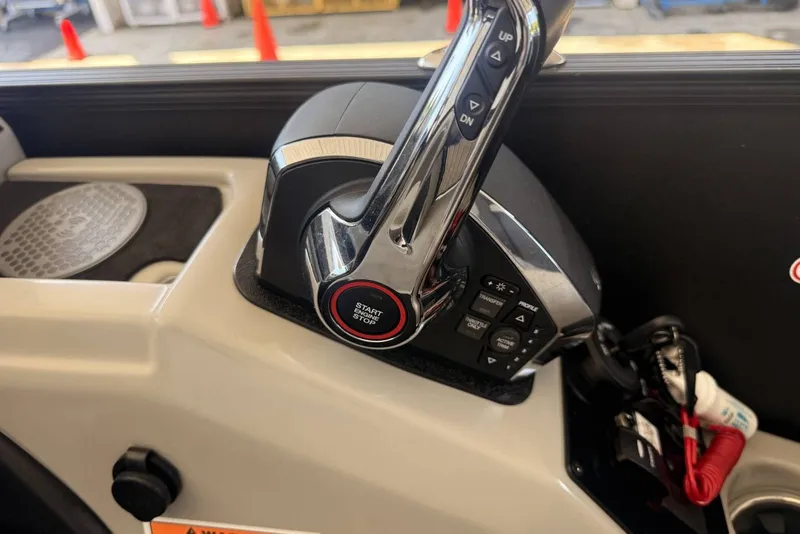 Slide: The Image of Control panel of 2025 Barletta Cabrio 24UE boat with start/stop button and throttle lever. - 13