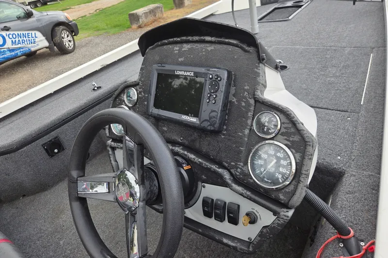 Slide: The Image of 2023 Ranger RT178 boat dashboard with steering wheel and Lowrance fishfinder. - 10