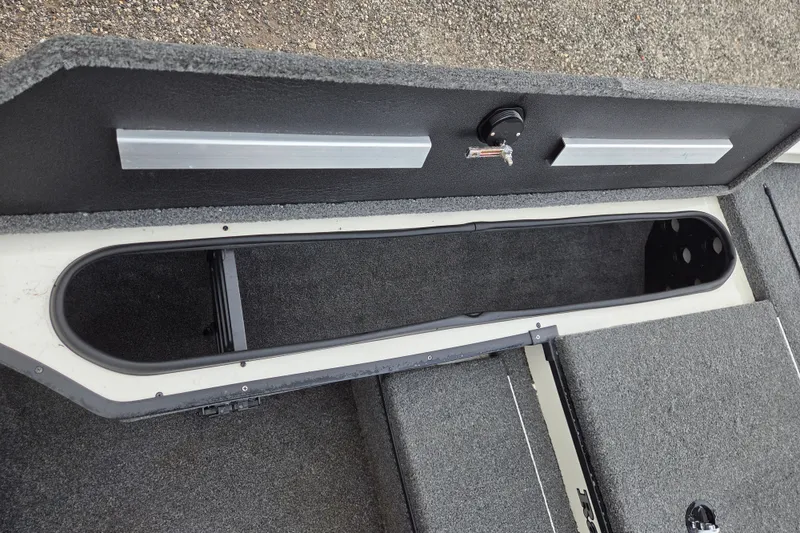 Slide: The Image of 2023 Ranger RT178 boat storage compartment with open lid, showcasing interior space. - 12