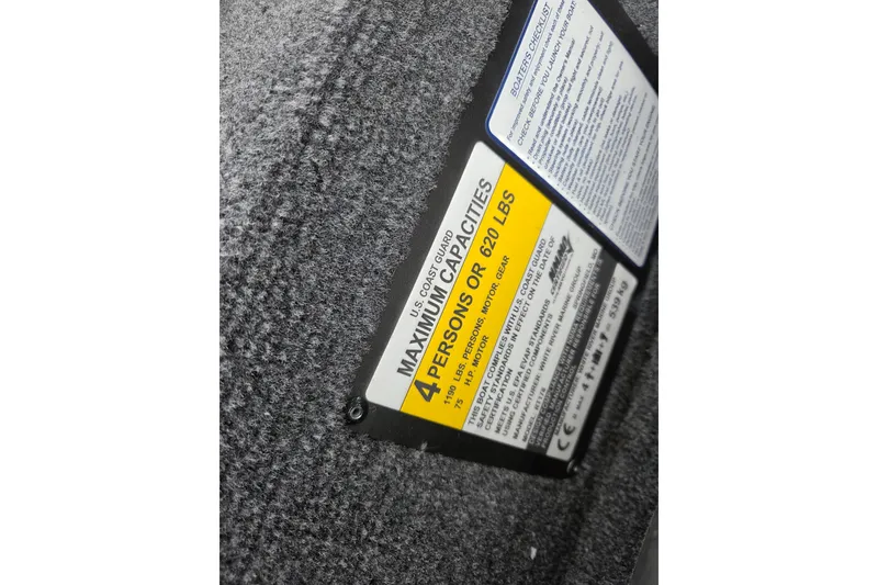 Slide: The Image of 2023 Ranger RT178 capacity label, maximum 4 persons or 620 lbs, safety instructions. - 9