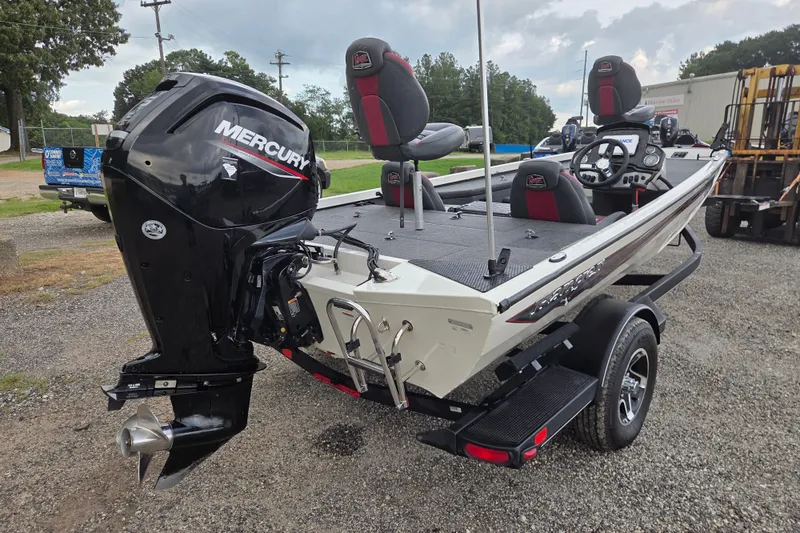 Slide: The Image of 2023 Ranger RT178 boat with Mercury outboard motor, parked on gravel. - 6
