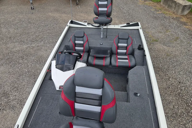 Slide: The Image of 2023 Ranger RT178 boat interior with gray and red seating, gravel background. - 15