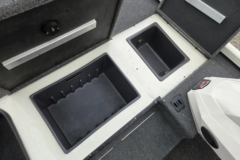 Slide: The Image of 2023 Ranger RT178 boat storage compartments with open lids, showcasing interior space. - 13