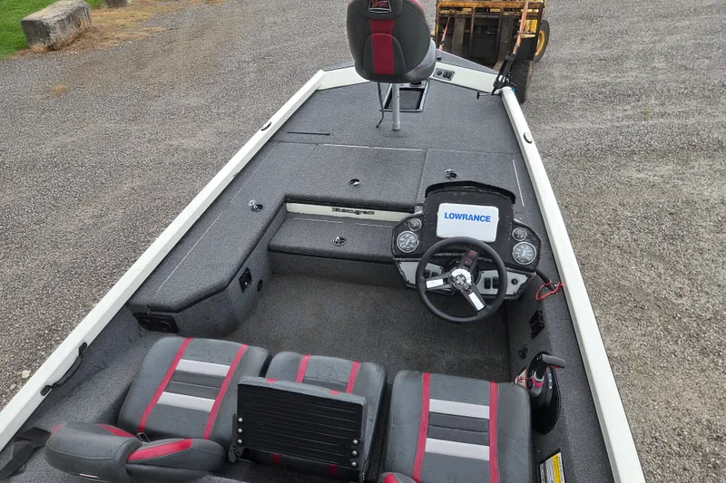 Slide: The Image of 2023 Ranger RT178 boat interior with steering wheel and Lowrance display. - 17