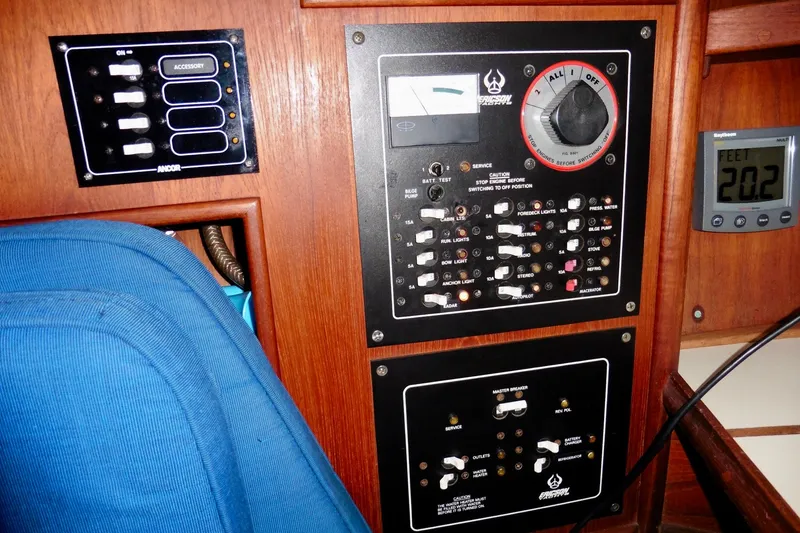 Slide: The Image of Control panel of a 1986 Ericson 35.3 sailboat with various switches and gauges. - 29