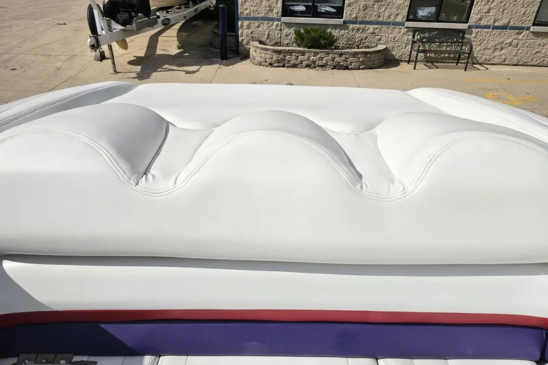 Slide: The Image of White leather seating on a 2003 Baja 342 boat, outdoor setting. - 78