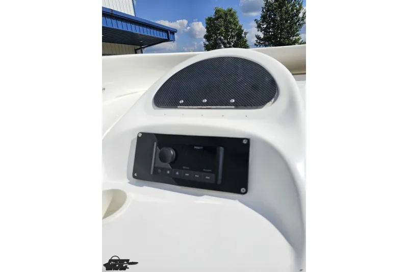 Slide: The Image of 2003 Baja 342 boat dashboard with stereo system and carbon fiber panel. - 45