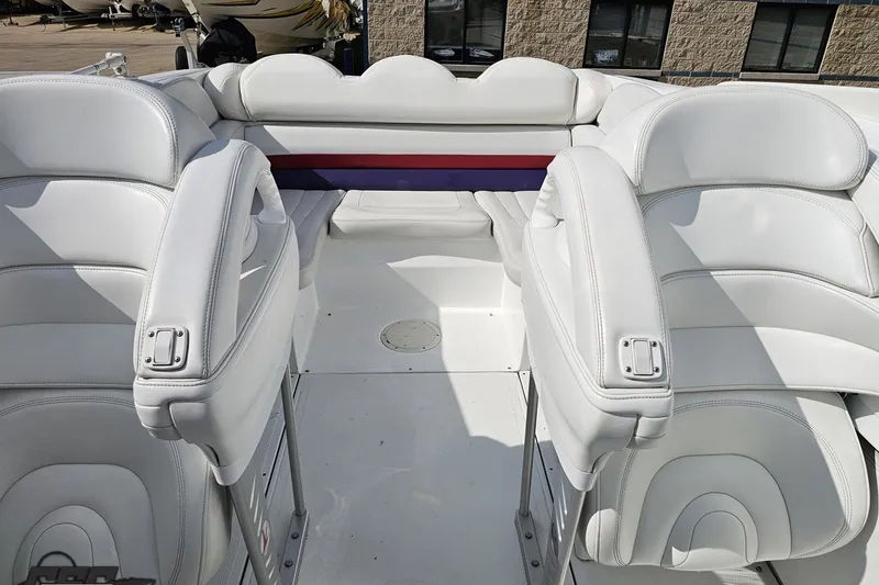 Slide: The Image of 2003 Baja 342 boat interior with white leather seating and modern design. - 71