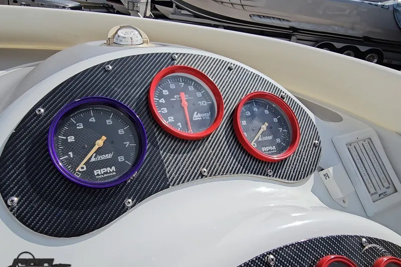 Slide: The Image of Dashboard of a 2003 Baja 342 boat with Livorsi gauges. - 51