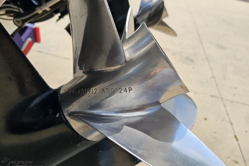 Slide: The Image of Close-up of a 2003 Baja 342 boat propeller with engraved specifications. - 27