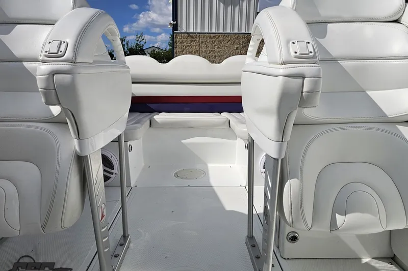 Slide: The Image of Interior of a 2003 Baja 342 boat with white leather seating and modern design. - 70
