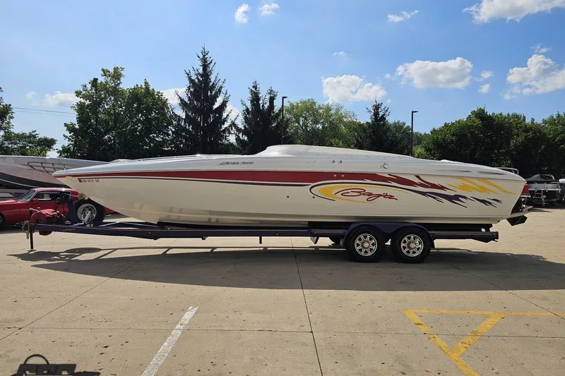 Slide: The Image of 2003 Baja 342 speedboat on trailer, parked outdoors under a clear sky. - 17