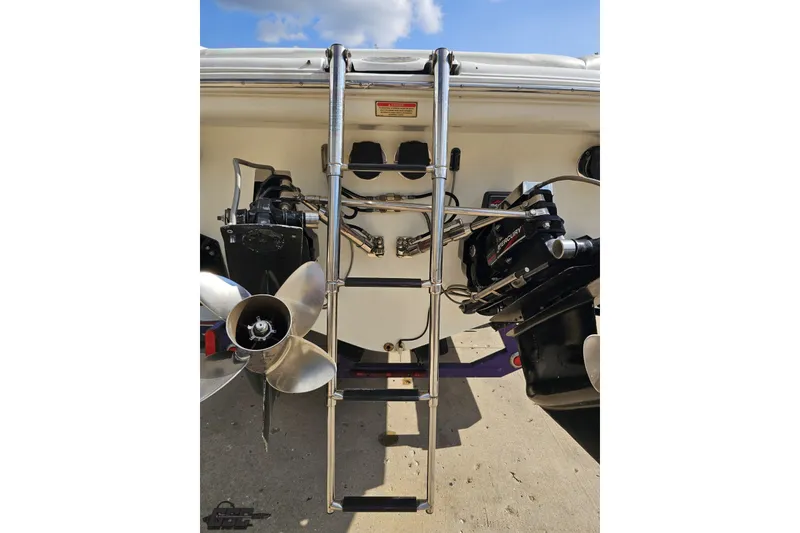 Slide: The Image of Rear view of 2003 Baja 342 boat with ladder and dual propellers. - 29
