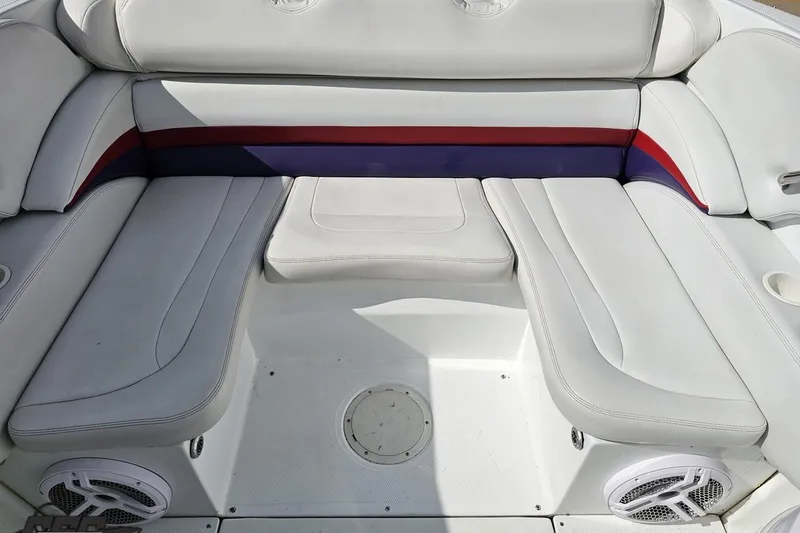 Slide: The Image of Interior seating of a 2003 Baja 342 boat with white upholstery and colorful accents. - 75