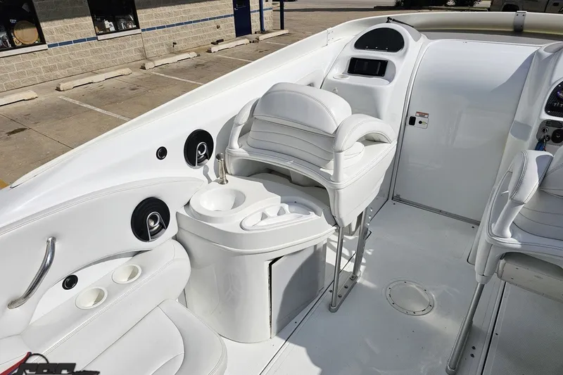 Slide: The Image of 2003 Baja 342 boat interior with white seating and cup holders. - 41
